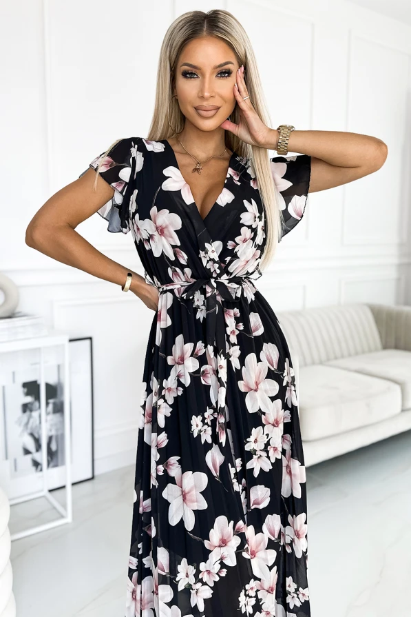 Moteriška suknelė su gėlių raštu, pasižyminti lengvai krentančiu, plisuotu audiniu. Suknelė turi trumpas rankoves ir elegantišką V formos iškirptę, suteikiančią rafinuotumo.