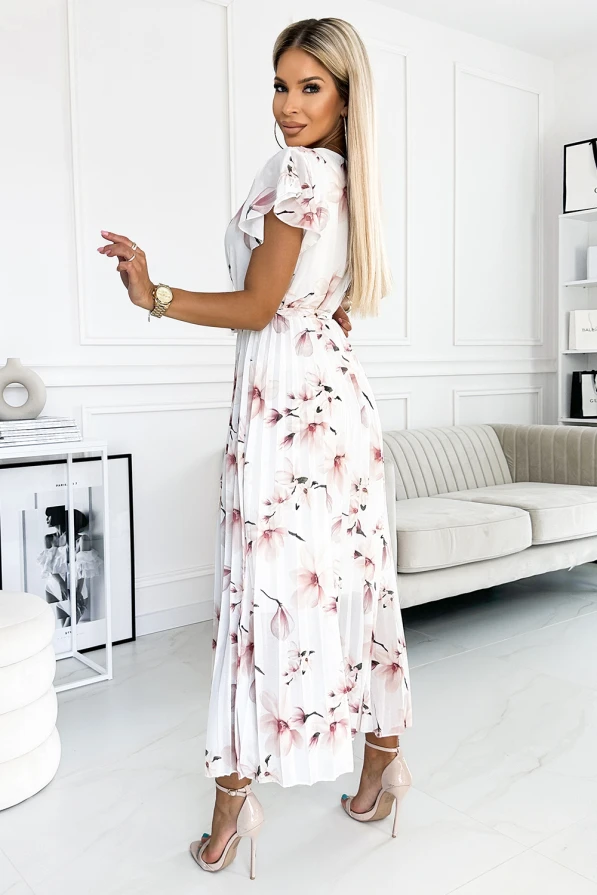 Elegantiška, ilga, plisuota suknelė su švelniais gėlių raštais, puikiai tinkanti vasaros progoms. Suknelė pasižymi lengvumu ir moteriškumu, suteikdama elegancijos ir rafinuotumo.